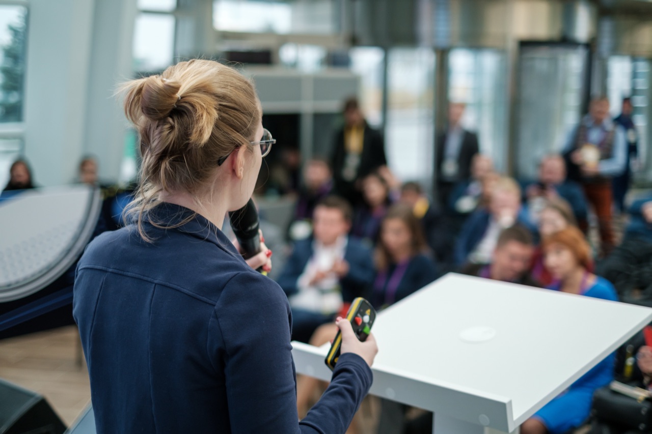 Presenter leading a training session for an audience